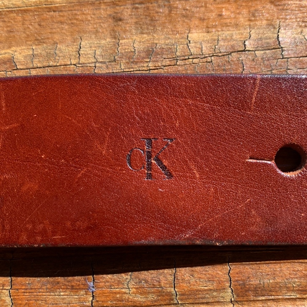 Ck belt brass
